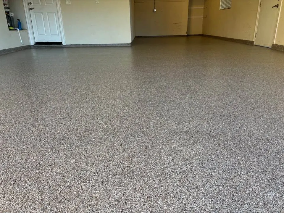 Tan flake epoxy garage floor by Vazquez Epoxy Coatings, serving Rancho Cordova, CA